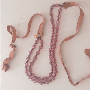 rosy pink beaded necklace that ties in back